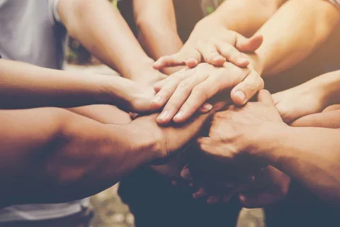 Hands supporting each other