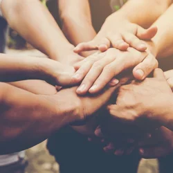 Hands supporting each other