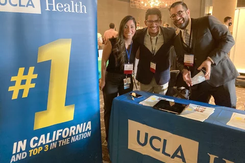 Community Investment Group at an event with UCLA banner