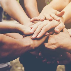 Hands supporting each other
